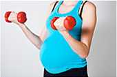 Pregnant woman lifting weights